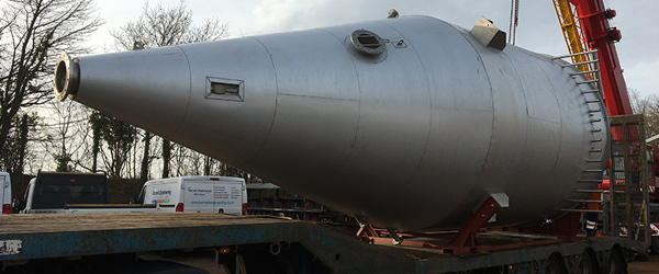 Large Cylindrical stainless steel reverse jet bagfilter lagged and clad, then delivered to our client in the UK.